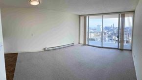 San Francisco apartment for rent - an empty living room with a view of the city