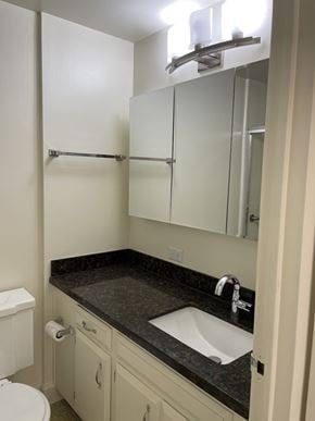 San Francisco apartment for rent - a small bathroom with a sink and a mirror
