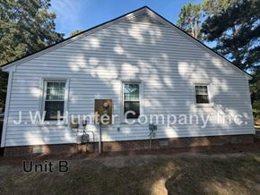 Wilson apartment for rent - A white building with J.W. Hunter Company Inc. written on it.