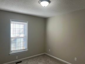 Wilson apartment for rent - A room with a window and a ceiling light.