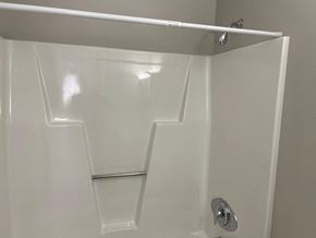 Wilson apartment for rent - A white shower stall with a silver handle.