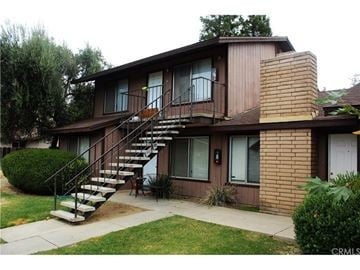 Merced house for rent - A brown house with a staircase leading to the second floor.