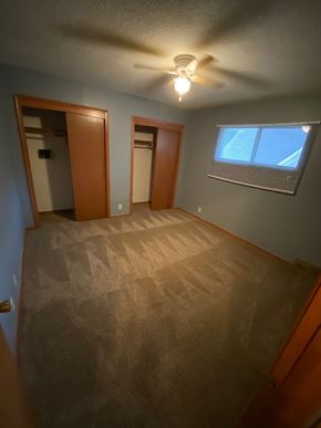 Omaha apartment for rent - a empty room with a ceiling fan and a window