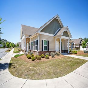 Ashburn apartment for rent - a house with a lawn and a sidewalk in front of it