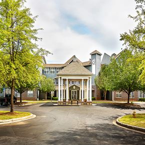 Decatur apartment for rent - a view of the front entrance of a building with trees