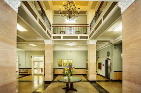 Valdosta apartment for rent - a large lobby with a table and a chandelier