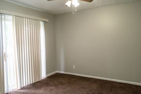 Lexington apartment for rent - an empty living room with a large window and blinds