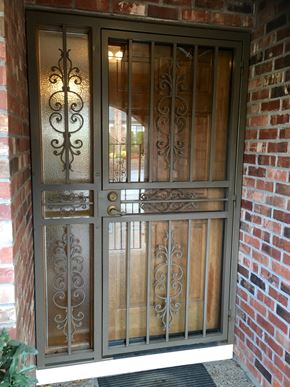Tigard house for rent - the front door of a brick house with a wrought iron door