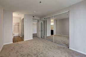 Hancock Park apartment for rent - One Bedroom Apartments in Hancock Park, CA - Apartment Carpeted Bedroom with Mirrored Closet and View of Bathroom