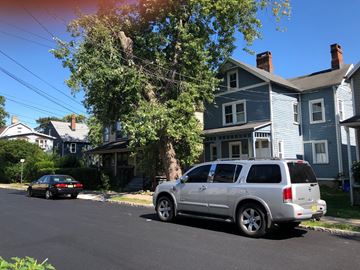 Montclair apartment for rent - A silver SUV is parked on the side of a street.