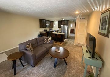 Omaha apartment for rent - a living room with a couch and a table
