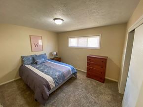 Omaha apartment for rent - a bedroom with a bed and a dresser