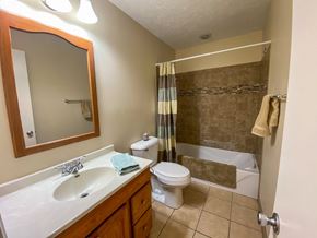 Omaha apartment for rent - a bathroom with a sink toilet and a shower