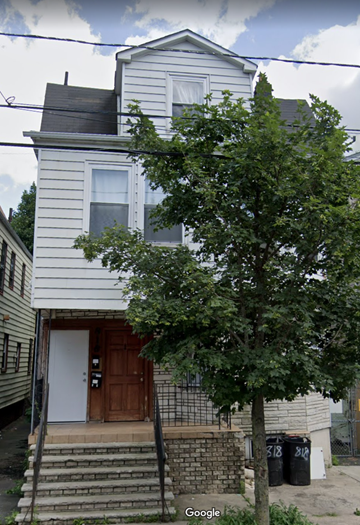 Newark apartment for rent - a white house with a tree in front of it