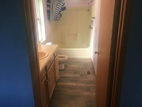 Prosser house for rent - A bathroom with a toilet, sink, and shower.