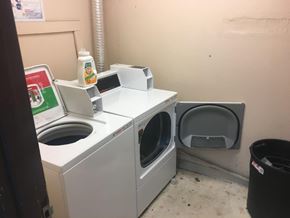 Pasco apartment for rent - A washing machine and dryer are in a small room.