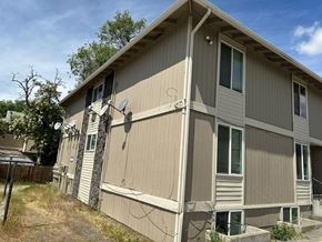Pasco apartment for rent - A beige house with a satellite dish on the roof.