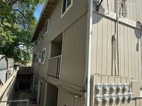 Pasco apartment for rent - A building with a balcony and satellite dishes on the roof.