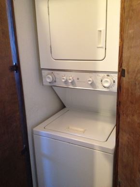 Kennewick apartment for rent - A white oven with a door and knobs on the side.