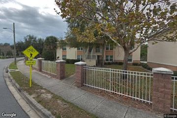 Clearwater apartment for rent - A pedestrian crossing sign is displayed on a street.