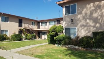 Torrance apartment for rent - Apartment building number 2405 with a green lawn in front.