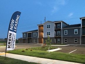 Siloam Springs apartment for rent - a street sign in front of an apartment building