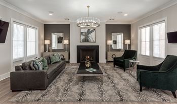Clubhouse with a couch, chair and fireplace