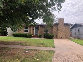 Snyder house for rent - a brick house with a sidewalk in front of it
