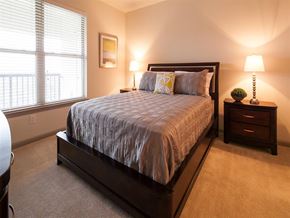 Sandy Springs apartment for rent - a bedroom with a bed and two night stands