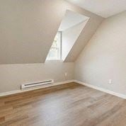 Tacoma apartment for rent - an empty bedroom with a window and wooden floors