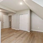 Tacoma apartment for rent - an empty living room with white walls and wood floors