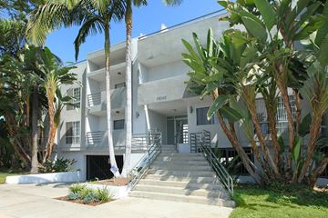 W. Toluca Lake apartment for rent - A white building with a black gate and steps leading up to it.