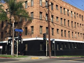 Los Angeles apartment for rent - a large brick building on the corner of a street