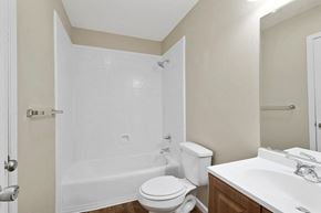 Slidell apartment for rent - a bathroom with a shower toilet and sink