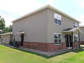 Stillwater house for rent - A house with a grey siding and a brick base.