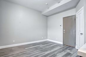 Oshawa apartment for rent - an empty room with grey walls and a door