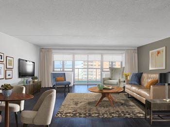 A living room with a brown leather couch, a wooden coffee table, and a flat-screen tv mounted on the wall.