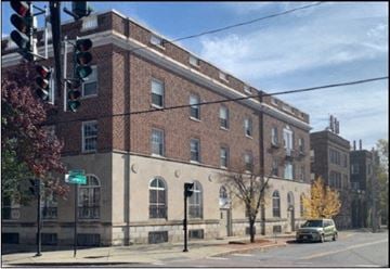 Albany apartment for rent - a building on the corner of a street with a traffic light