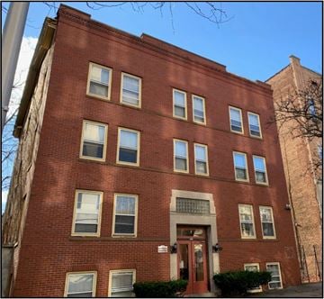 Albany apartment for rent - a large brick building with a red door