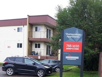 Chetwynd apartment for rent - an apartment building with cars parked in front of it
