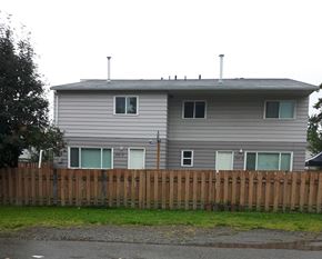 Chetwynd apartment for rent - the back of a house with a wooden fence