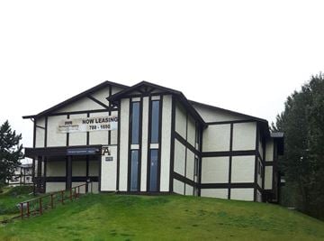 Chetwynd apartment for rent - a white and black building with a sign on it