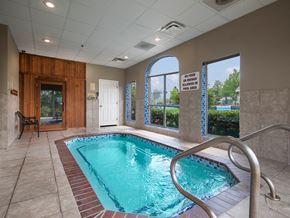 Grandview apartment for rent - a swimming pool in a building with a door and a window
