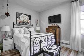Oshawa apartment for rent - a bedroom with a bed and a tv in it