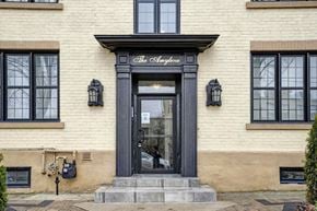 Oshawa apartment for rent - the facade of a building with a black door
