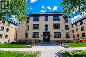 Oshawa apartment for rent - a large building with a sidewalk in front of it