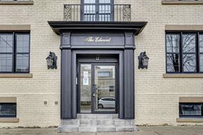 Oshawa apartment for rent - the facade of a building with a glass door