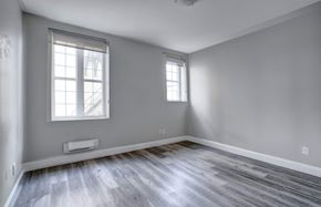 Oshawa apartment for rent - the living room of an empty house and wood floors