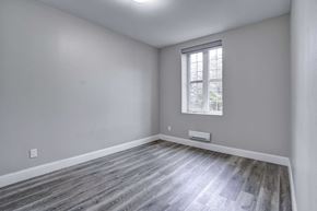 Oshawa apartment for rent - an empty room with white walls and a window