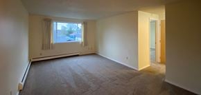 Sitka apartment for rent - an empty living room with a large window